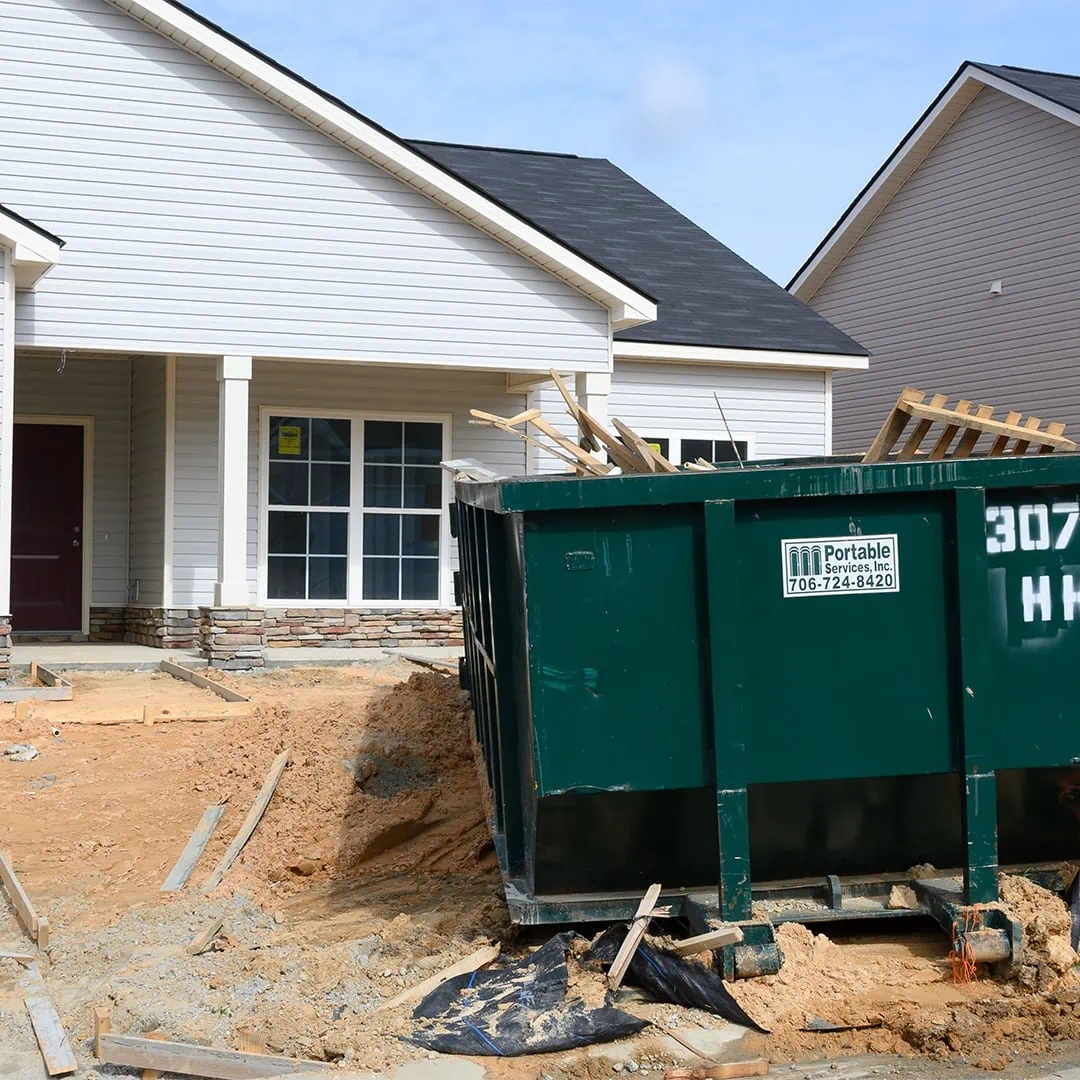 15-yard roll-off dumpster at a residential project